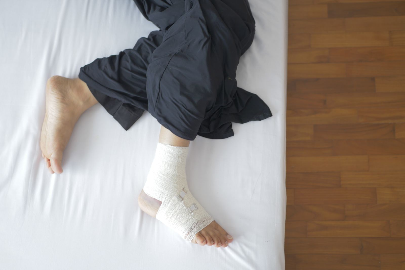 Diabetic foot ulcers: a bandaged foot resting at home during recovery